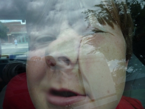 A student squishes his face against the glass as his church arrived at World Changers Roanoke, VA